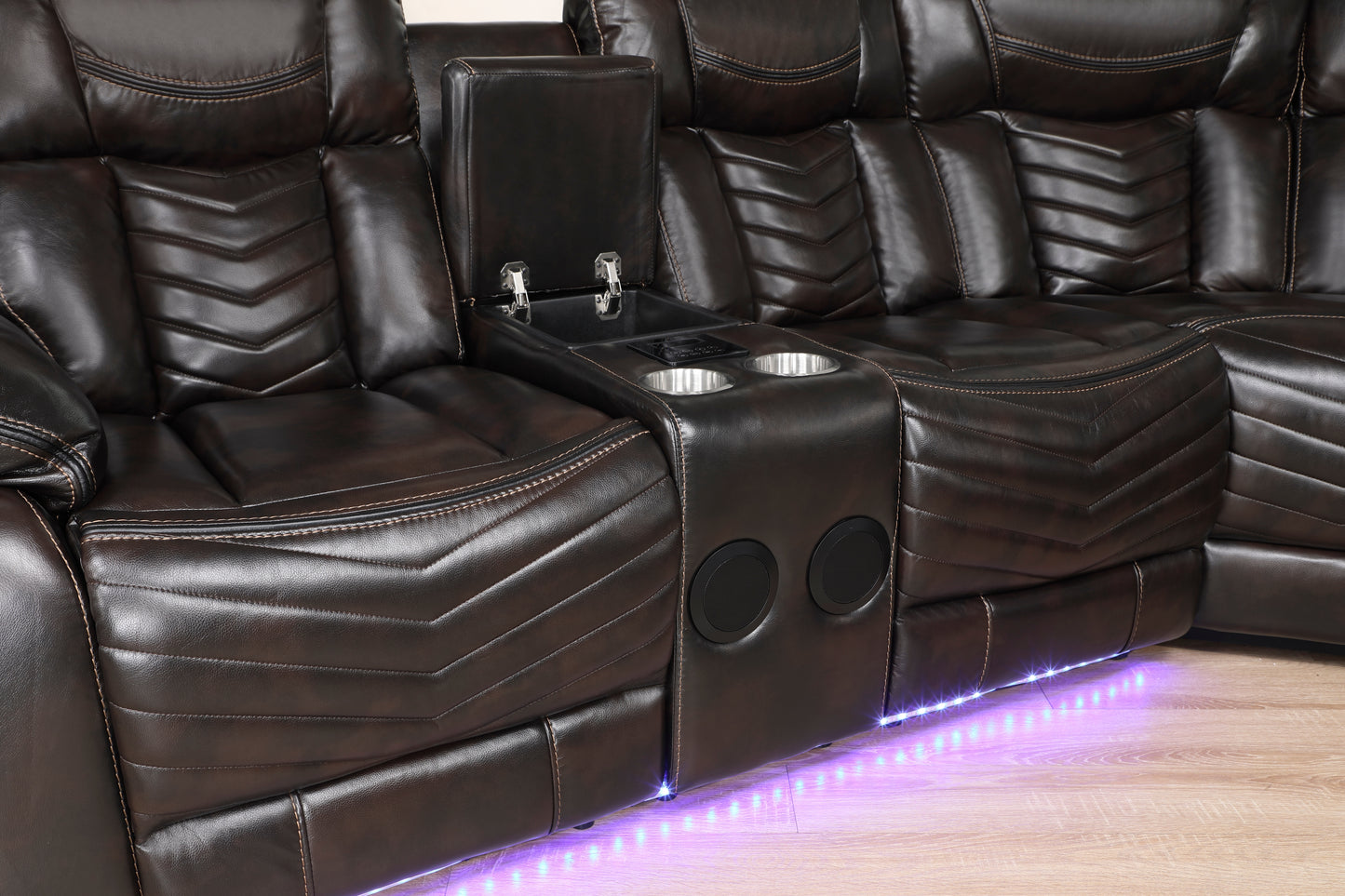 Integrated center console of the Ramone sectional featuring dual cup holders and storage compartment – available at Paty Furniture in Tacoma, Kent, and Burien.
Vibrant LED lighting along the base of the Ramone sectional, enhancing the home theater experience – available at Paty Furniture in Tacoma, Kent, and Burien.