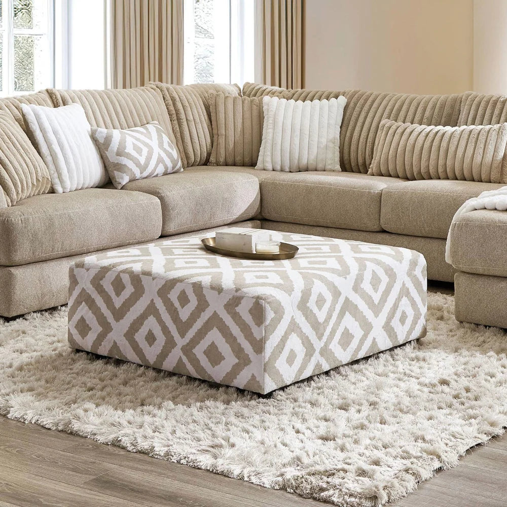 Loughton Collection ottoman in light brown chenille upholstery measuring 41 inches square with padded top and wooden legs – available at Paty Furniture in Tacoma, Kent, and Burien.