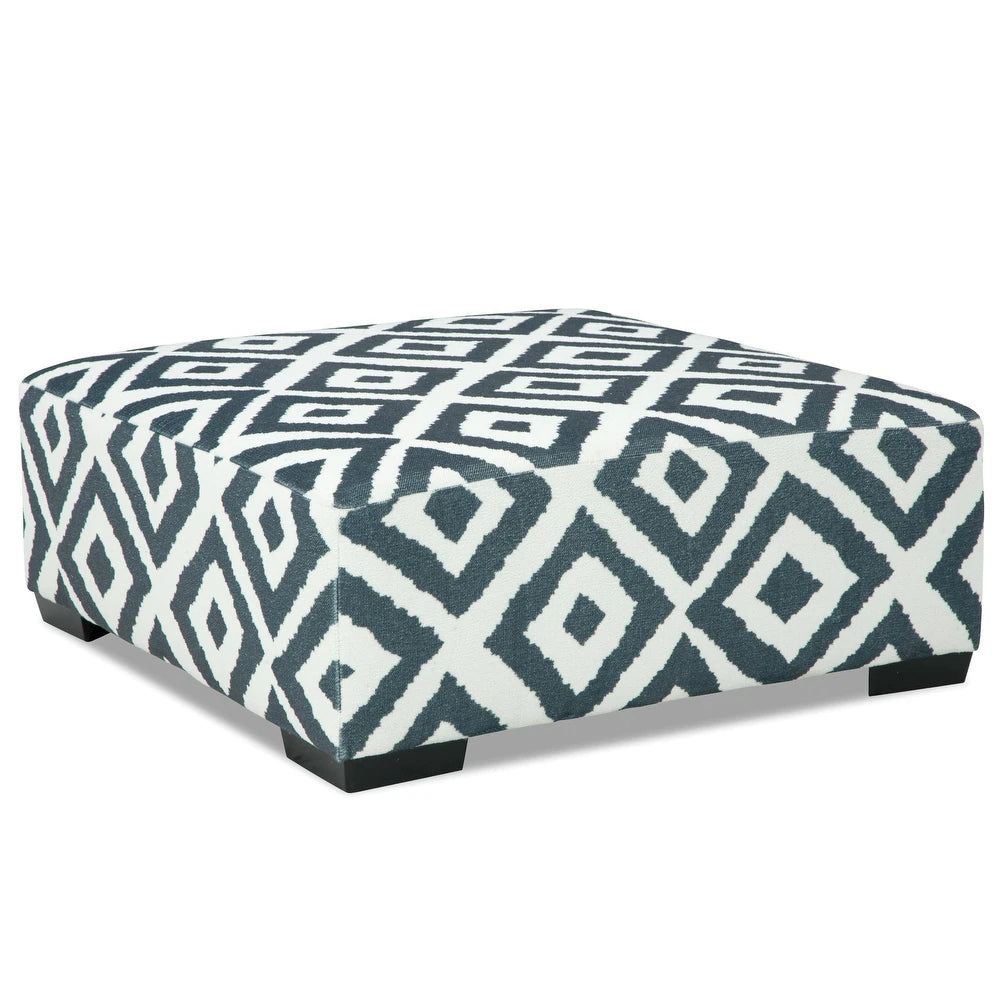 Loughton Collection ottoman in gun metal chenille upholstery measuring 41 inches square with padded top and wooden legs – available at Paty Furniture in Tacoma, Kent, and Burien.