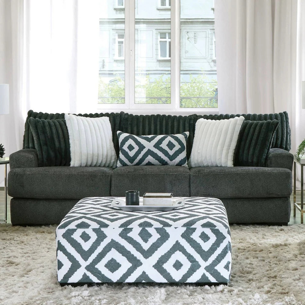 Loughlin Collection sofa with ultra-soft back cushions, channel tufting, padded arms, and T-seat cushions in gun metal chenille fabric – available at Paty Furniture in Tacoma, Kent, and Burien.