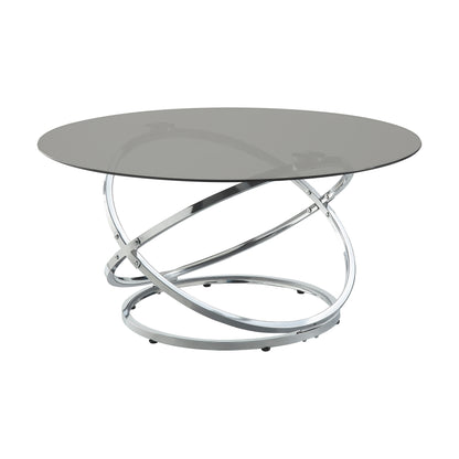 Marion Collection square cocktail table with a black tempered glass top and chrome-finished metal base featuring intersecting circular lines – available at Paty Furniture in Tacoma, Kent, and Burien.