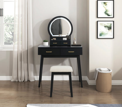 Camilla Collection vanity set in black finish featuring an LED-lit framed mirror, gold-tone drawer pulls, and a matching upholstered stool – available at Paty Furniture in Tacoma, Kent, and Burien.