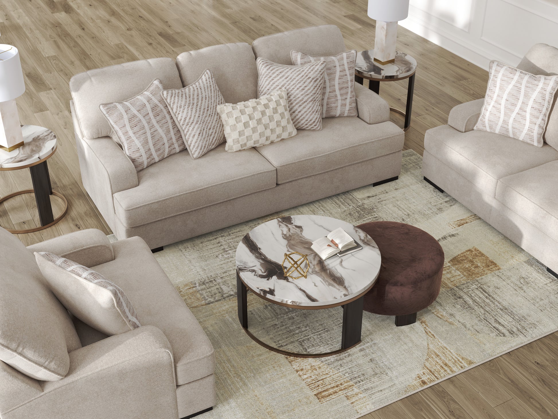 Living room with beige sofa, armchair, and coffee table on a patterned rug.