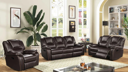 Brown leather reclining sofa  love seat and chair set in a living room with decor elements.