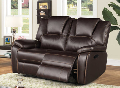 Brown leather reclining Love Seat in a living room setting with windows and decor.