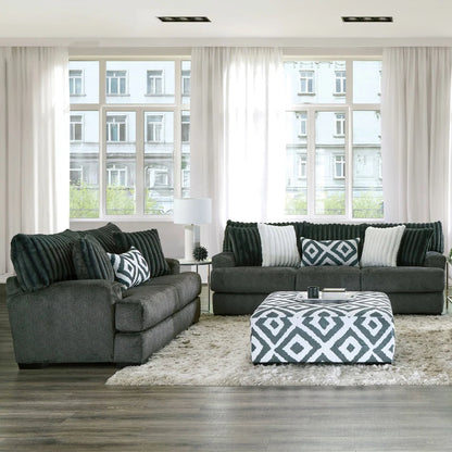 Loughlin Collection living room set featuring a sofa, loveseat and ottoman in gun metal chenille upholstery with channel-tufted cushions and wooden legs – available at Paty Furniture in Tacoma, Kent, and Burien.

