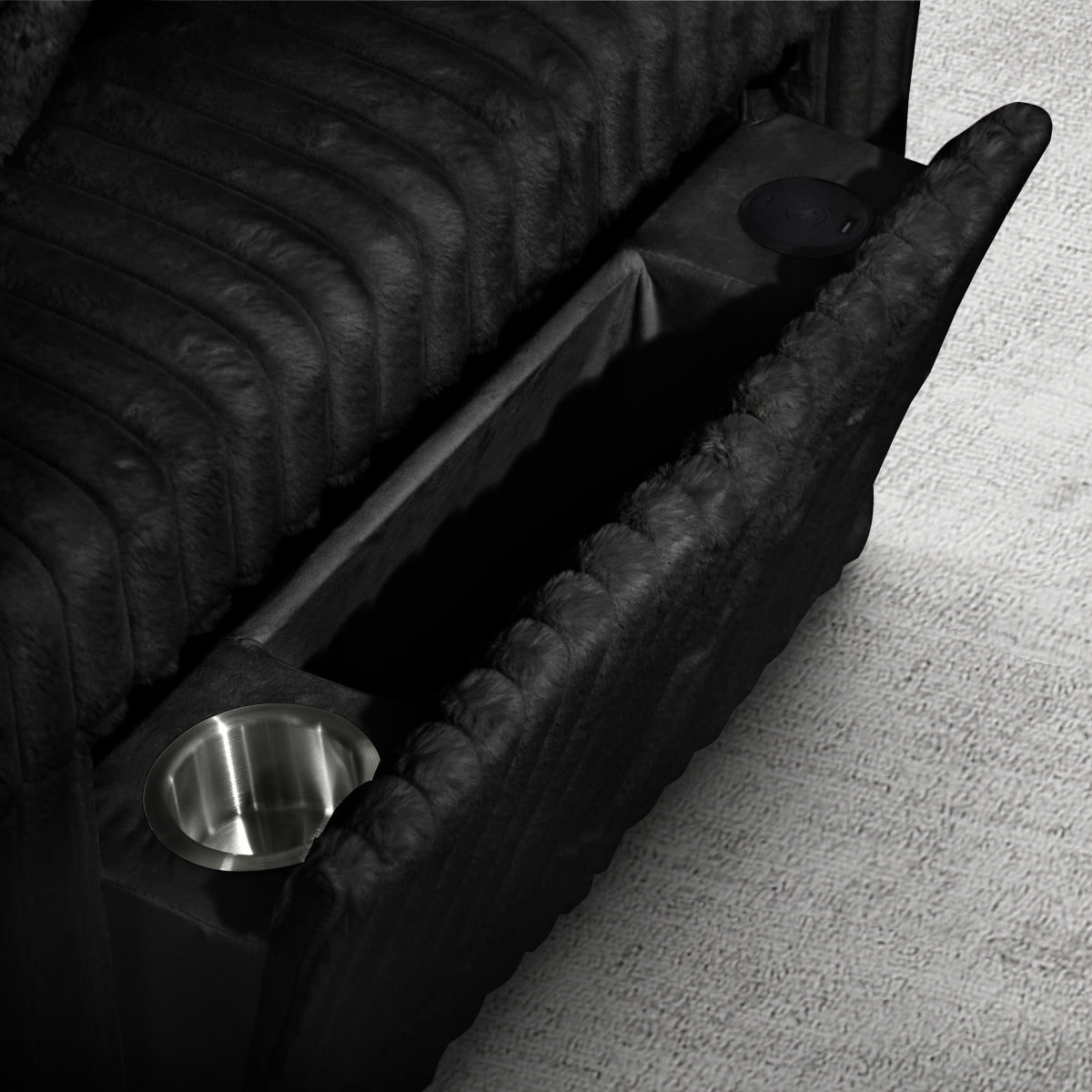 Black Riverton sectional arm storage compartment and cup holder
