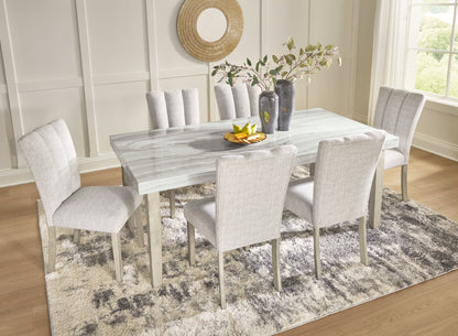 Larawyn faux marble dining table and upholstered chairs lifestyle view