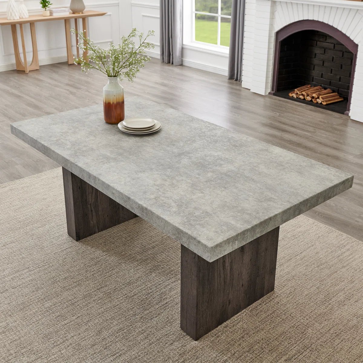 Sorlen dining table with gray faux concrete top and double pedestal base